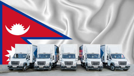Nepal flag in the background. Five new white trucks are parked in the parking lot. Truck, transport, freight transport. Freight and logistics conceptの写真素材