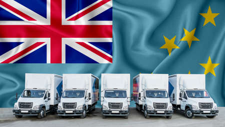 Tuvalu flag in the background. Five new white trucks are parked in the parking lot. Truck, transport, freight transport. Freight and logistics conceptの写真素材