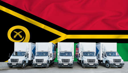 vanuatu flag in the background. Five new white trucks are parked in the parking lot. Truck, transport, freight transport. Freight and logistics conceptの写真素材