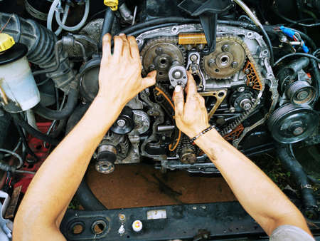 Repair of the internal combustion engine of a passenger car. repair of an open motor gear replacement.の写真素材