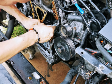 Repair of the internal combustion engine of a passenger car. repair of an open motor gear replacement.の写真素材