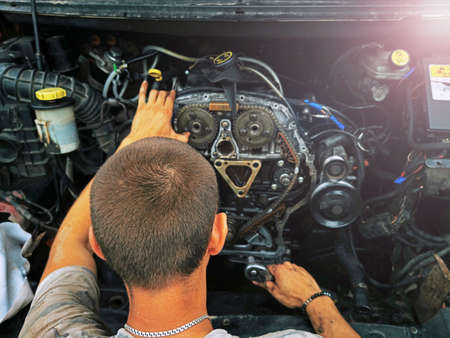 Repair of the internal combustion engine of a passenger car. repair of an open motor gear replacement.の写真素材