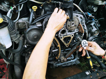 Repair of the internal combustion engine of a passenger car. repair of an open motor gear replacement.の写真素材