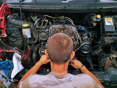 Repair of the internal combustion engine of a passenger car. repair of an open motor gear replacement.の写真素材