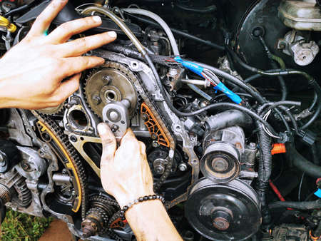 Repair of the internal combustion engine of a passenger car. repair of an open motor gear replacement.の写真素材