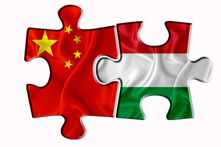 Hungary flag and China of America flag on two puzzle pieces on white isolated background. The concept of political relations. 3D renderingの写真素材