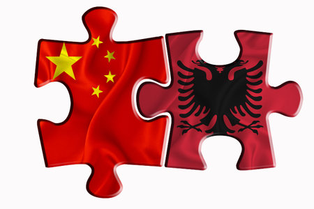Albania flag and China of America flag on two puzzle pieces on white isolated background. The concept of political relations. 3D renderingの写真素材