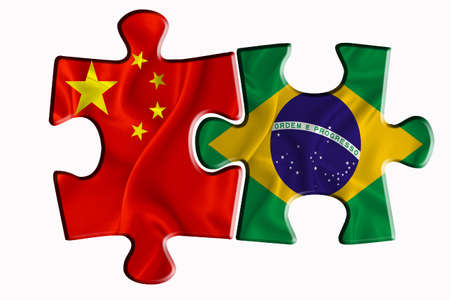 Brazil flag and China of America flag on two puzzle pieces on white isolated background. The concept of political relations. 3D renderingの写真素材