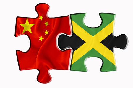 Jamaika flag and China of America flag on two puzzle pieces on white isolated background. The concept of political relations. 3D renderingの写真素材