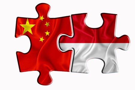 Indonesia flag and China of America flag on two puzzle pieces on white isolated background. The concept of political relations. 3D renderingの写真素材