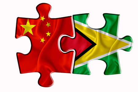 GUYANA flag and China of America flag on two puzzle pieces on white isolated background. The concept of political relations. 3D renderingの写真素材