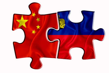 Liechtenstein flag and China of America flag on two puzzle pieces on white isolated background. The concept of political relations. 3D renderingの写真素材
