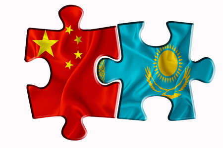 Kazakhstan flag and China of America flag on two puzzle pieces on white isolated background. The concept of political relations. 3D renderingの写真素材