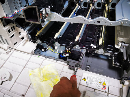 A man replaces toner in a laser printer. toner cartridge for printer printing laser stationery office equipment repair concept, digital copierの写真素材