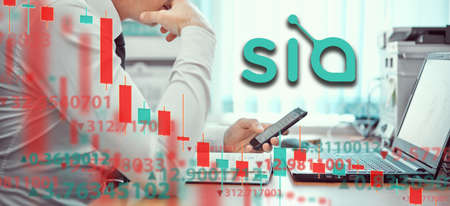 Young businessmen are analyzing the stock market at laptop. Business and finance, technology, cryptocurrency, stock crisis, falling prices, downward chart, or Forex chart, the collapse of economy.の写真素材