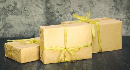 Three presents on wooden floorの写真素材