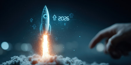 Businessman touches 2026 virtual numbers and rocket icon symbolizing business growth and innovation success.の写真素材