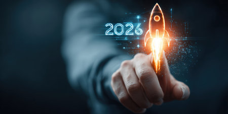 Businessman touches 2026 virtual numbers and rocket icon symbolizing business growth and innovation success.の写真素材