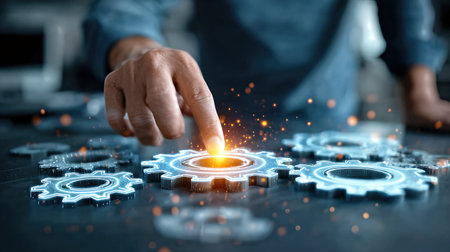 A businessman adjusts glowing holographic gears, symbolizing automation, teamwork, and advanced technology in modern industry.の素材