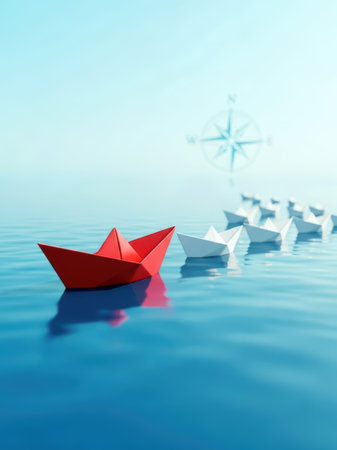 A red origami paper boat leading a line of white paper boats on a calm blue ocean, symbolizing leadership and individuality.の素材
