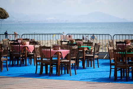 a cozy and beautiful cafe on the seashore is waiting for visitorsの写真素材