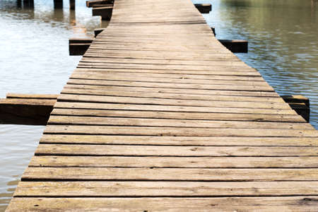 Wooden bridge on a lake in the forest