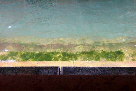 Stair at water with color gradient and circles on the water