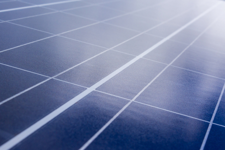 Blue solar panels with light reflection, abstract closeupの写真素材