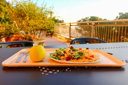 Mediterranean lunch or dinner on a warm sunny day in an outdoors restaurantの写真素材