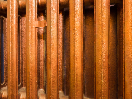 Bars of old copper heating radiator closeupの写真素材