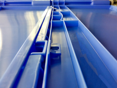 Blue plastic container boxes on top of each otherの写真素材