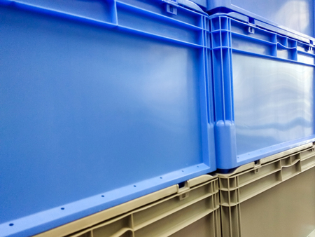 Blue and grey plastic container boxes on top of each otherの写真素材