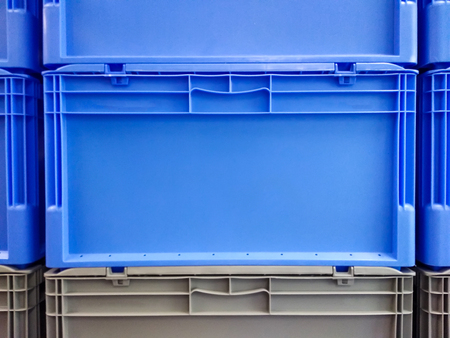 Blue and grey plastic container boxes on top of each otherの写真素材