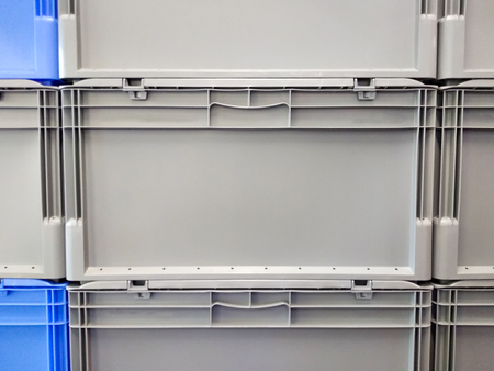 Blue and grey plastic container boxes on top of each otherの写真素材