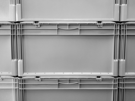 Grey plastic container boxes on top of each otherの写真素材