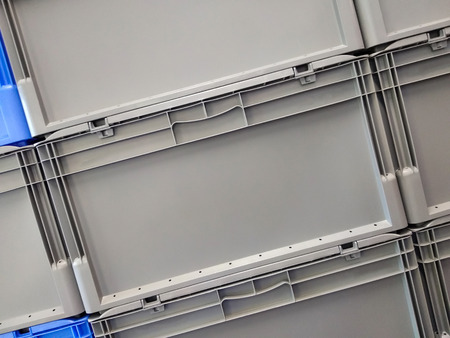 Blue and grey plastic container boxes on top of each otherの写真素材