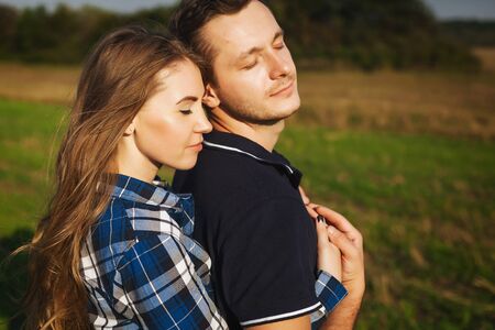 sweet couple embrace passionately in natureの写真素材