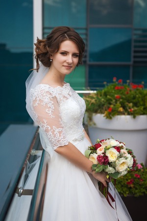Young luxury bride with flower bouquetの写真素材