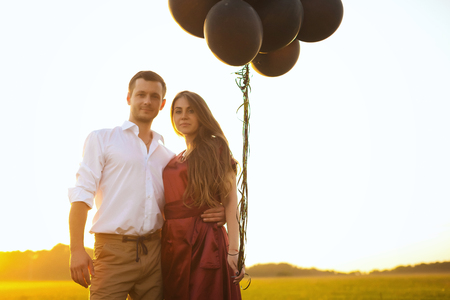 Honeymoon couple romantic in love at field sunriseの写真素材