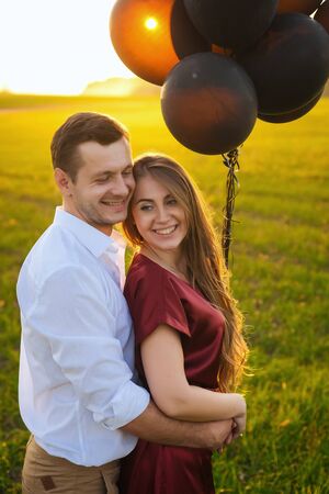 Honeymoon couple romantic in love at field sunriseの写真素材