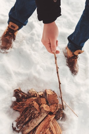 man kindle a bonfire, campfireの写真素材