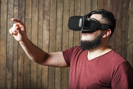 Man with vr glasses showing gesture. Virtual reality glassesの写真素材