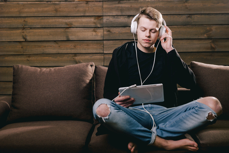 man listening favorite music with closed eyesの写真素材