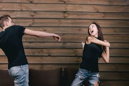 happy couple having pillow fightの写真素材