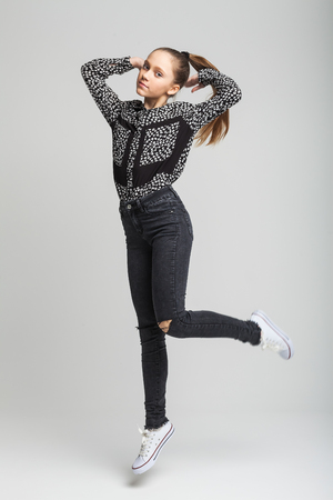 Young cute girl jumpingの写真素材