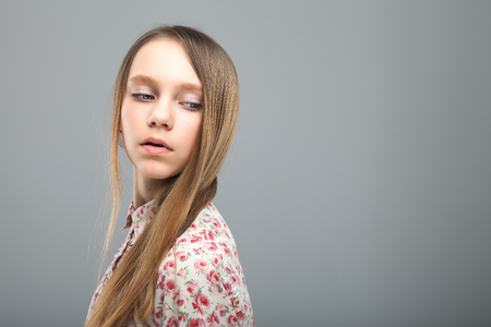 young cute girl with long brown hairの写真素材