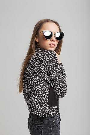 Young cute girl with sunglassesの写真素材