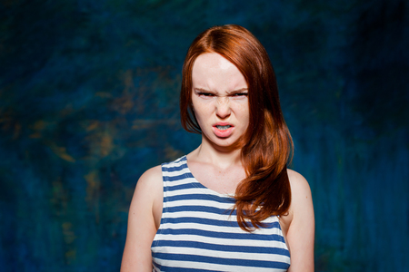 Angry redhead girlの写真素材