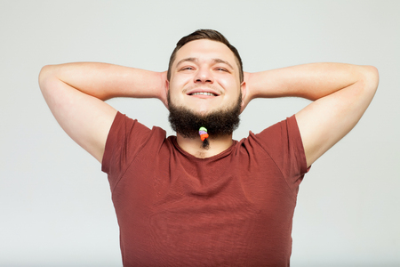 happy fat man with beard clipsの写真素材