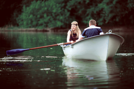 girl rowing on lakeの写真素材